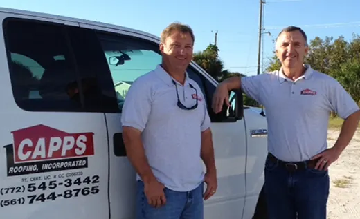 Blake and Mark Capps beside a Capps Roofing truck